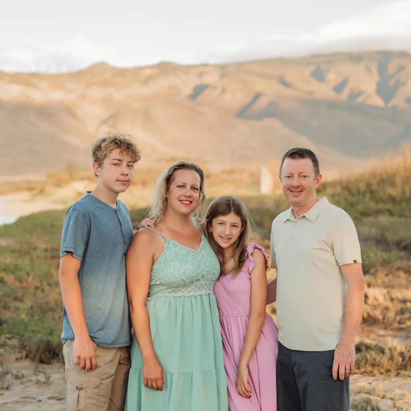 Crystal and Nathan Phillis — owners of Agate Home Services — with their family
